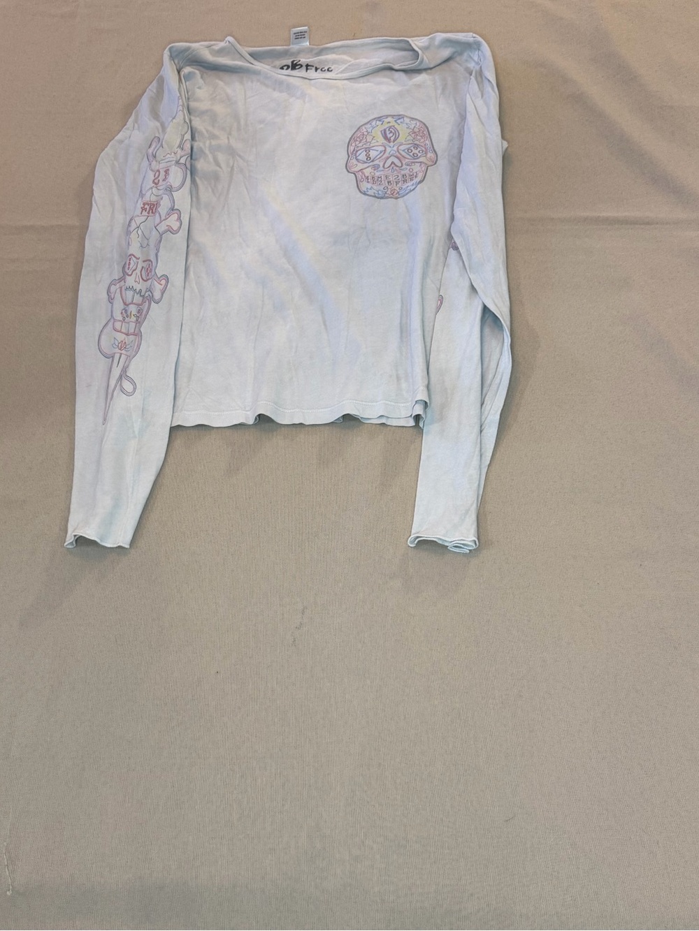 Women’s Light Blue Long Sleeve Graphic Tee with Skull Detail
